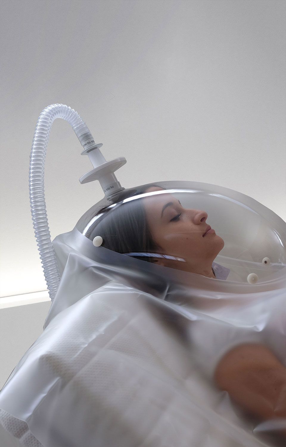 Woman under canopy hood