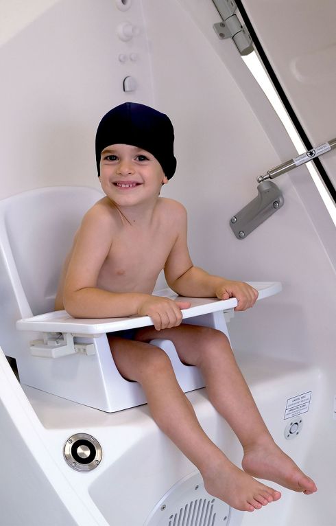 BOD POD GS-X - Boy sitting on Pediatric Option Module